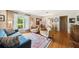 Cozy living room with large windows, plush seating, hardwood floors, and tasteful décor at 1516 Arthur St, Orlando, FL 32804