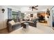 Spacious living room with a plush sectional couch, fan and large windows for plenty of natural light at 1516 Arthur St, Orlando, FL 32804