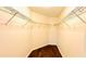 Walk-in closet with ample shelving, providing plenty of storage and organization space for clothing at 15637 Carina Dr, Orlando, FL 32828