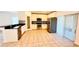 Well-lit kitchen with stainless steel appliances, white cabinets, and granite countertops, ideal for cooking at 15637 Carina Dr, Orlando, FL 32828