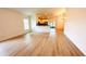 Open living room featuring hardwood floors, great for entertaining and relaxing, and seamlessly connects to the kitchen at 15637 Carina Dr, Orlando, FL 32828