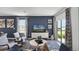 Comfortable living room with modern furniture, neutral tones, and a sliding glass door at 16341 Lakelet Aly, Winter Garden, FL 34787