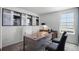 The office includes a wooden desk, a window, and stylish artwork at 16341 Lakelet Aly, Winter Garden, FL 34787