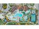 Top-down view of a resort-style community pool with water slides, a area, and a splashpad at 2186 Tripoli Ct, Kissimmee, FL 34747