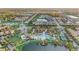 Expansive aerial shot showcasing a community with multiple ponds, green spaces, and organized residential areas at 2186 Tripoli Ct, Kissimmee, FL 34747