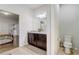 Bathroom featuring tile flooring, a large mirror, a granite vanity, and a view into the connected bedroom at 2186 Tripoli Ct, Kissimmee, FL 34747