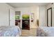 Bedroom with two twin beds, a view into the living room, and a view into the bathroom at 2186 Tripoli Ct, Kissimmee, FL 34747
