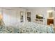 Well lit bedroom with a TV, dresser, closet and ensuite bathroom at 2186 Tripoli Ct, Kissimmee, FL 34747