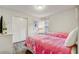 Bright bedroom with two twin beds, closet, and accent decor at 2186 Tripoli Ct, Kissimmee, FL 34747