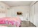 Well-lit bedroom featuring twin beds and closet with a view to ensuite bathroom at 2186 Tripoli Ct, Kissimmee, FL 34747