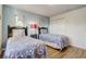 Bright bedroom with two twin beds, neutral walls, and ample storage at 2186 Tripoli Ct, Kissimmee, FL 34747