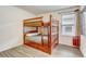 Bedroom with wooden bunk beds and natural light, perfect for  at 2186 Tripoli Ct, Kissimmee, FL 34747