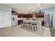 Modern kitchen with stainless steel appliances, granite countertops, and a breakfast bar with seating, perfect for casual dining at 2186 Tripoli Ct, Kissimmee, FL 34747