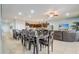 Bright and airy living space featuring a large dining table, open kitchen, and comfortable living room with ample seating at 2186 Tripoli Ct, Kissimmee, FL 34747