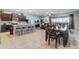 Open-concept living space with a modern kitchen, dining area, and comfortable living room, perfect for entertaining and relaxing at 2186 Tripoli Ct, Kissimmee, FL 34747