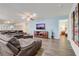 Comfortable living room with leather seating, television, and easy access to the adjacent bedroom, creating a cozy atmosphere at 2186 Tripoli Ct, Kissimmee, FL 34747