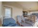 Cozy outdoor patio with a grill, lounge chairs, and a bar-height table at 2186 Tripoli Ct, Kissimmee, FL 34747