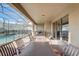 Spacious outdoor patio with multiple dining areas and a view of the pool at 2186 Tripoli Ct, Kissimmee, FL 34747