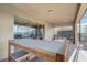 Covered patio with outdoor seating and a view of the screened-in pool area at 2186 Tripoli Ct, Kissimmee, FL 34747
