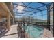 Outdoor screened-in pool and patio area for ultimate relaxation and enjoyment at 2186 Tripoli Ct, Kissimmee, FL 34747