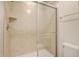 A walk in shower with a glass door and tiled surround at 2186 Tripoli Ct, Kissimmee, FL 34747