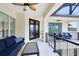 Covered balcony features comfortable seating and views of the surrounding area and exterior of the home at 2245 Bronco Dr., St Cloud, FL 34771