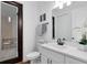 Clean, modern bathroom features a white vanity, brushed fixtures, and a glass-enclosed shower at 2245 Bronco Dr., St Cloud, FL 34771