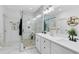 Beautiful bathroom with stone shower and dual sink vanity with modern fixtures at 2245 Bronco Dr., St Cloud, FL 34771