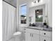 Elegant bathroom featuring marble floors, a white vanity, and a relaxing ambiance at 2245 Bronco Dr., St Cloud, FL 34771