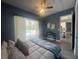 Cozy bedroom with a ceiling fan, view of the pool, and access to the kitchen at 2245 Bronco Dr., St Cloud, FL 34771