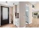 Welcoming entryway features hardwood floors, a stylish chandelier, and a convenient wet bar at 2245 Bronco Dr., St Cloud, FL 34771