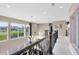 Open hallway with staircase views of the living area and abundant natural light at 2245 Bronco Dr., St Cloud, FL 34771
