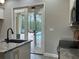A view from the kitchen looking out to the screened-in pool area at 2245 Bronco Dr., St Cloud, FL 34771