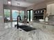 A detailed view of the kitchen with granite countertops, a black sink, and a view to the patio at 2245 Bronco Dr., St Cloud, FL 34771