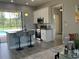 A kitchen with granite countertops, stainless steel appliances and an island with stools at 2245 Bronco Dr., St Cloud, FL 34771