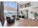 Stunning living room with high ceilings, large windows, and a cozy fireplace at 2245 Bronco Dr., St Cloud, FL 34771