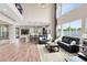 Bright and airy living room with soaring ceilings, hardwood floors, and a modern design at 2245 Bronco Dr., St Cloud, FL 34771