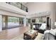 Spacious living room featuring an open floor plan, hardwood floors, and a view of the pool at 2245 Bronco Dr., St Cloud, FL 34771