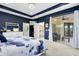 Well-lit bedroom features an accent wall, large windows, closet access and balcony entry at 2245 Bronco Dr., St Cloud, FL 34771