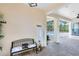 Covered outdoor patio leading to an in-ground pool with view of a wooded landscape at 2245 Bronco Dr., St Cloud, FL 34771