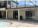 Outdoor patio with brick pavers, ceiling fans, and a view of the pool, perfect for entertaining at 2245 Bronco Dr., St Cloud, FL 34771