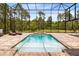 Inviting screened pool area featuring a private pool, spa, and lounge chairs, perfect for relaxation at 2245 Bronco Dr., St Cloud, FL 34771