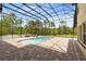 Enclosed pool area features a brick-paved patio and comfortable lounge seating at 2245 Bronco Dr., St Cloud, FL 34771
