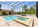 Private screened pool and hot tub provides a refreshing oasis with ample space for lounging at 2245 Bronco Dr., St Cloud, FL 34771