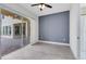 Bright room with sliding glass doors to the patio and neutral gray walls at 2245 Bronco Dr., St Cloud, FL 34771