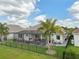 Aerial view of a well-maintained home with a screened-in patio and a fenced yard at 2586 Lancaster Ridge, Davenport, FL 33837