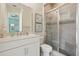 Bathroom featuring a glass shower, single vanity, and decor at 2586 Lancaster Ridge, Davenport, FL 33837