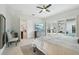 Spacious bedroom with a TV, dresser, and sliding glass doors revealing the pool area at 2586 Lancaster Ridge, Davenport, FL 33837