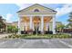Community clubhouse featuring classic architecture, well-maintained landscaping and ample parking at 2586 Lancaster Ridge, Davenport, FL 33837