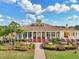 Stately clubhouse entrance with meticulously manicured landscaping in a vibrant community setting at 2586 Lancaster Ridge, Davenport, FL 33837